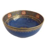 An early 20th century Wedgwood lustreware bowl: the central interior with a gilded floral motif
