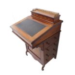 A late 19th century rosewood and boxwood-strung Davenport Desk; three-quarter gilt metal galleried