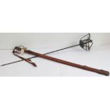 A Royal Artillery regulation pattern officer's sword with leather scabbard and an earlier sword with