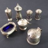 A hallmarked silver pepperette, together with matching salt with blue-glass liner by Walker and