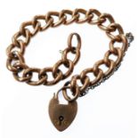 A 9-carat yellow gold bracelet and padlock clasp, most of the plain or engraved oval belcher links