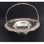 A large early 19th century Sheffield plated bread/cake basket; the swing handle with a central