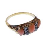 A late Victorian coral and diamond-set yellow gold ring, the three oval coral cabochons separated by