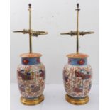 A pair of late 19th century Japanese gilded imari-style vases (now as lamps): each on gilded, turned