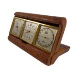 An early / mid 20th century leather-cased travelling clock set comprising separate barometer,