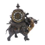 An unusual 19th century eight-day spelter-cased mantle clock modelled as a big cat attacking an