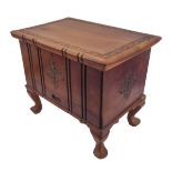 A small carved Eastern hardwood chest: the overhanging top above a pull-out top compartment