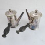 A pair of 19th century silver plated lidded chocolate pots having turned ebonised handles, each