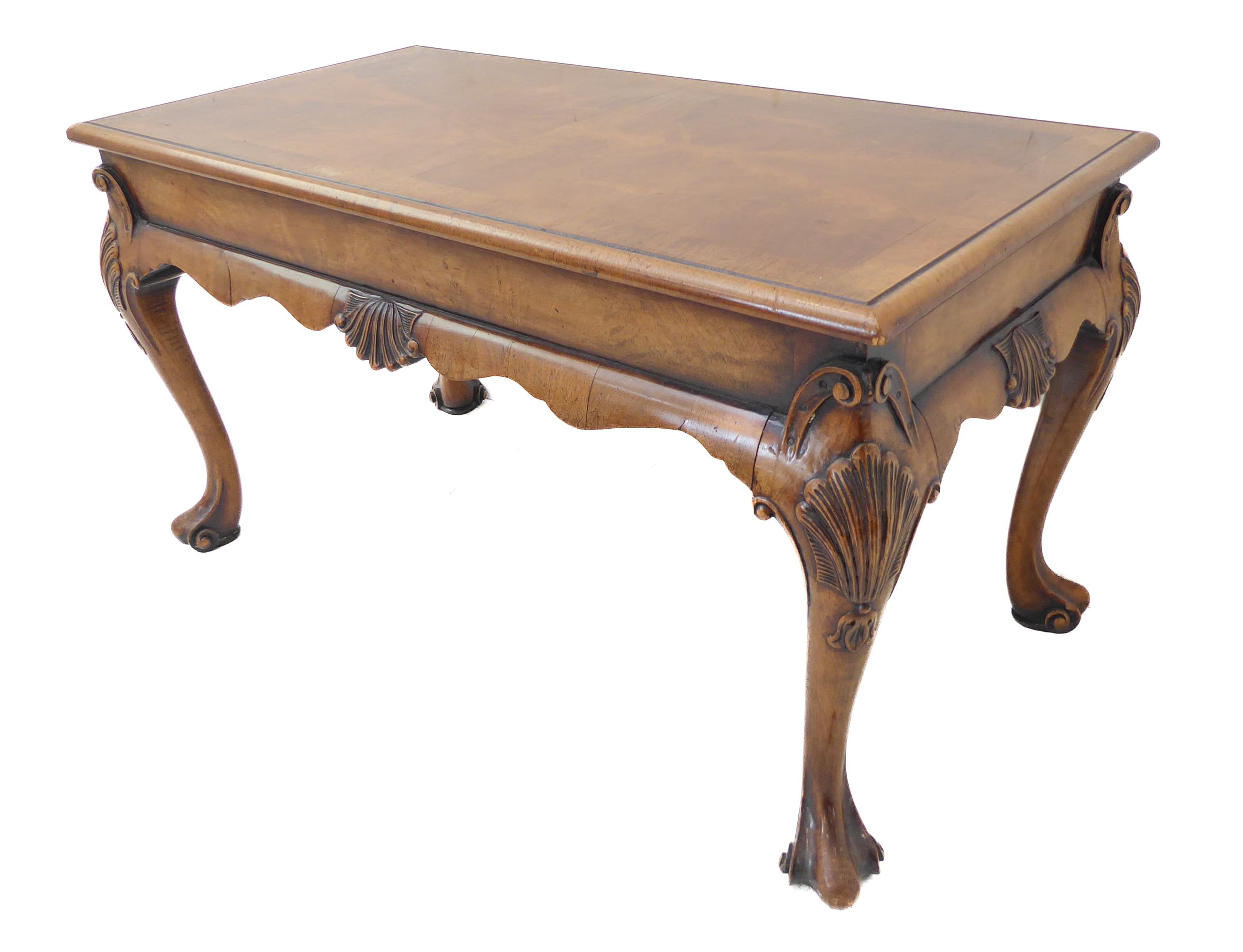 A good walnut coffee table in 18th century style: the quarter veneered crossbanded moulded top above