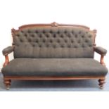 A large mid-19th century button-back-upholstered show wood sofa: the top rail with central well-