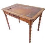 A late 19th century Aesthetic movement Oregon pine writing table: the leather inset top with faux