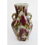 A 19th century Chinese porcelain Hu vase: red ochre and light-brown trickling glazes against a