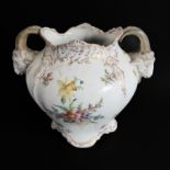 An early 20th century two-handled Dresden porcelain vase; hand gilded and decorated with floral