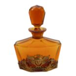 A circa 1920s / 1930s faceted amber scent bottle of flattened octagonal form: the lower section with