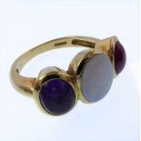 An opal, ruby, amethyst and 18-carat yellow gold ring, each oval cabochon collet set to the wide