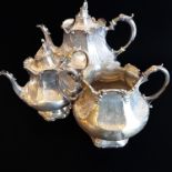 A heavy matched hallmarked silver tea service comprising teapot, large two-handled sugar and smaller