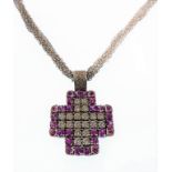 A heavy 18-carat white gold, pink sapphire and diamond pendant on an 18-carat gold seven-strand