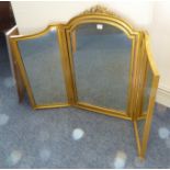 A good and large three-fold gilt-framed dressing-table mirror surmounted with pierced ribbons  (83cm