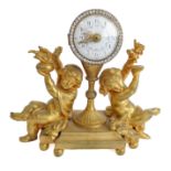 An early to mid 19th century small and heavy French ormolu figural mantle clock: the white enamel