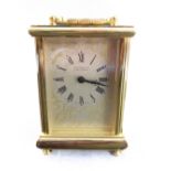 A 20th century gilt metal carriage clock: the dial signed Martin & Co. Cheltenham and with Roman