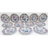 A good set of twelve 18th century Chinese porcelain plates: flowerhead shaped borders surrounding