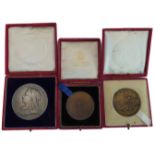 Three late Victorian medallions in their original red Morocco cases: 1. 1837-1897 Victoria