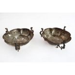 A pair of 19th century hallmarked silver flowerhead-shaped three-handled sweetmeat dishes; the