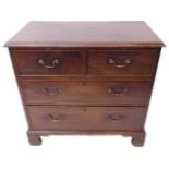 A late 18th century mahogany chest of small proportions: the moulded top above two half-width and