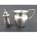 A late 19th century hallmarked silver cream jug together with a hallmarked pepperette (2) (total