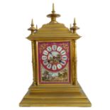 A good and heavy 19th century ormolu clock with hand-gilded and decorated porcelain panels: the