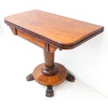 A good late Regency period rosewood foldover card table; vertical conical-shaped stem leading down