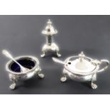 A mid 20th century three-piece hallmarked silver cruet set comprising circular salt with blue-