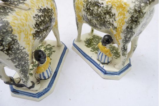 A pair of early 19th century Prattware-style pottery cow creamers (minus covers): each with curled - Image 4 of 8