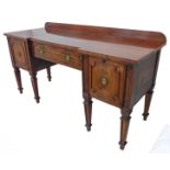 A large George III period (late 18th / early 19th) century breakfront sideboard: banded mahogany,