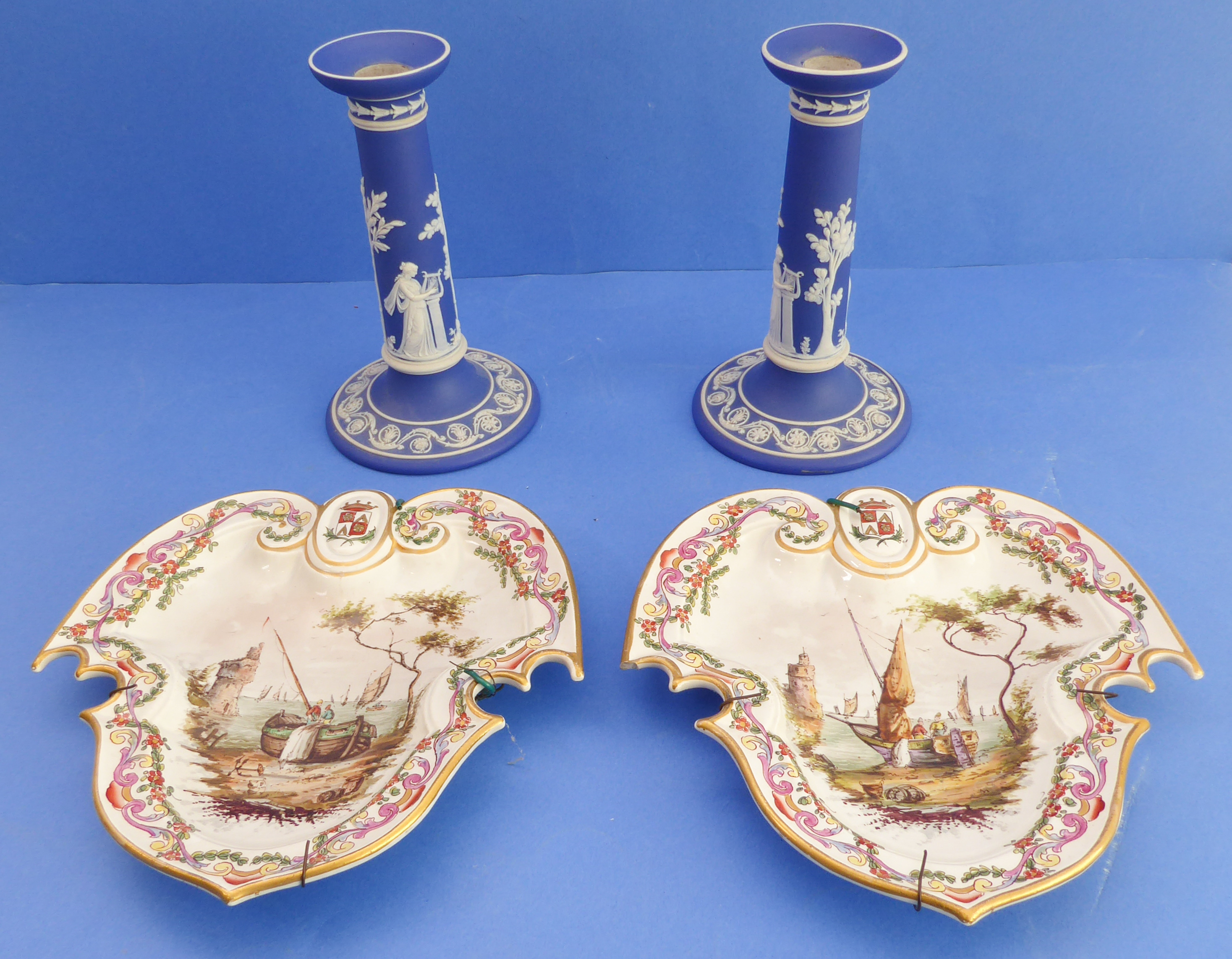 A pair of 19th century Wedgwood Jasperware table candlesticks: typically applied with classical-