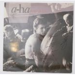 Autographed Vinyl - a-ha, Hunting High And Low. Original UK album signed by all 3 members.