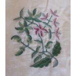 A pair of cream linen type material curtains decorated with embroidered sprigs of flowers, box pleat