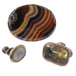 Three items of early 19th century jewellery: an oval banded agate brooch within a yellow gold collet