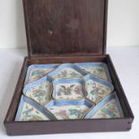 A cased Chinese porcelain hors d'oeuvres set: the central concave sided piece surrounded by four