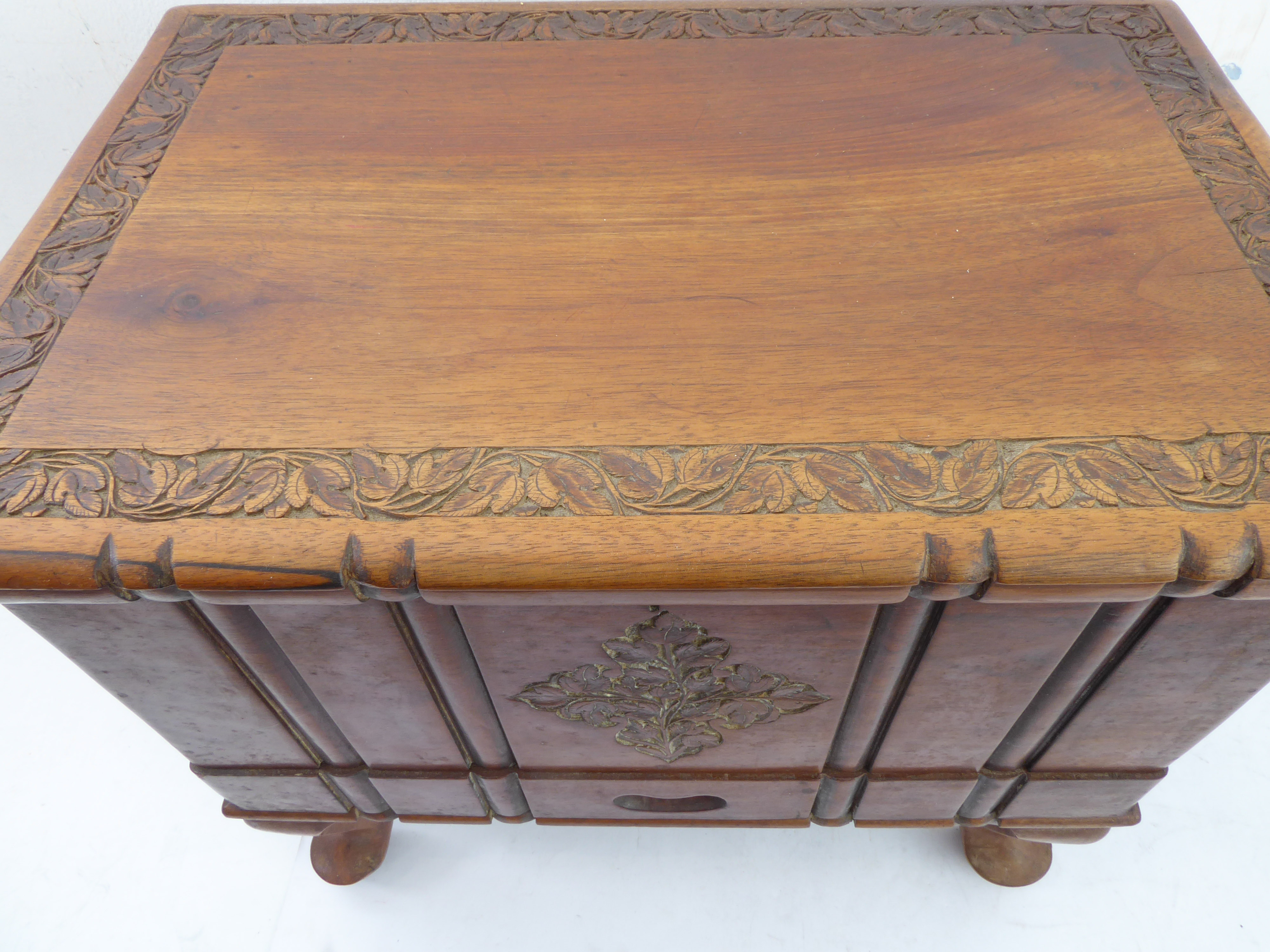 A small carved Eastern hardwood chest: the overhanging top above a pull-out top compartment - Image 4 of 5