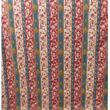 A pair of tapestry weave effect curtains in a red and green medieval style pattern, goblet headings,