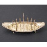 A late 18th century style hallmarked silver boat-shaped six-division toast rack: gadrooned border