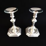 A pair of early 18th century style (later) heavy cast solid hallmarked silver candlesticks, later