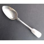 An early Victorian hallmarked silver fiddle pattern serving spoon with engraved monogram W S R,