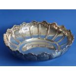 A large hallmarked silver bowl with Monteith-style raised border and lower lappet-type base, on