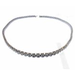 A fine quality white gold graduated diamond necklace consisting of 10.5 carats of diamonds