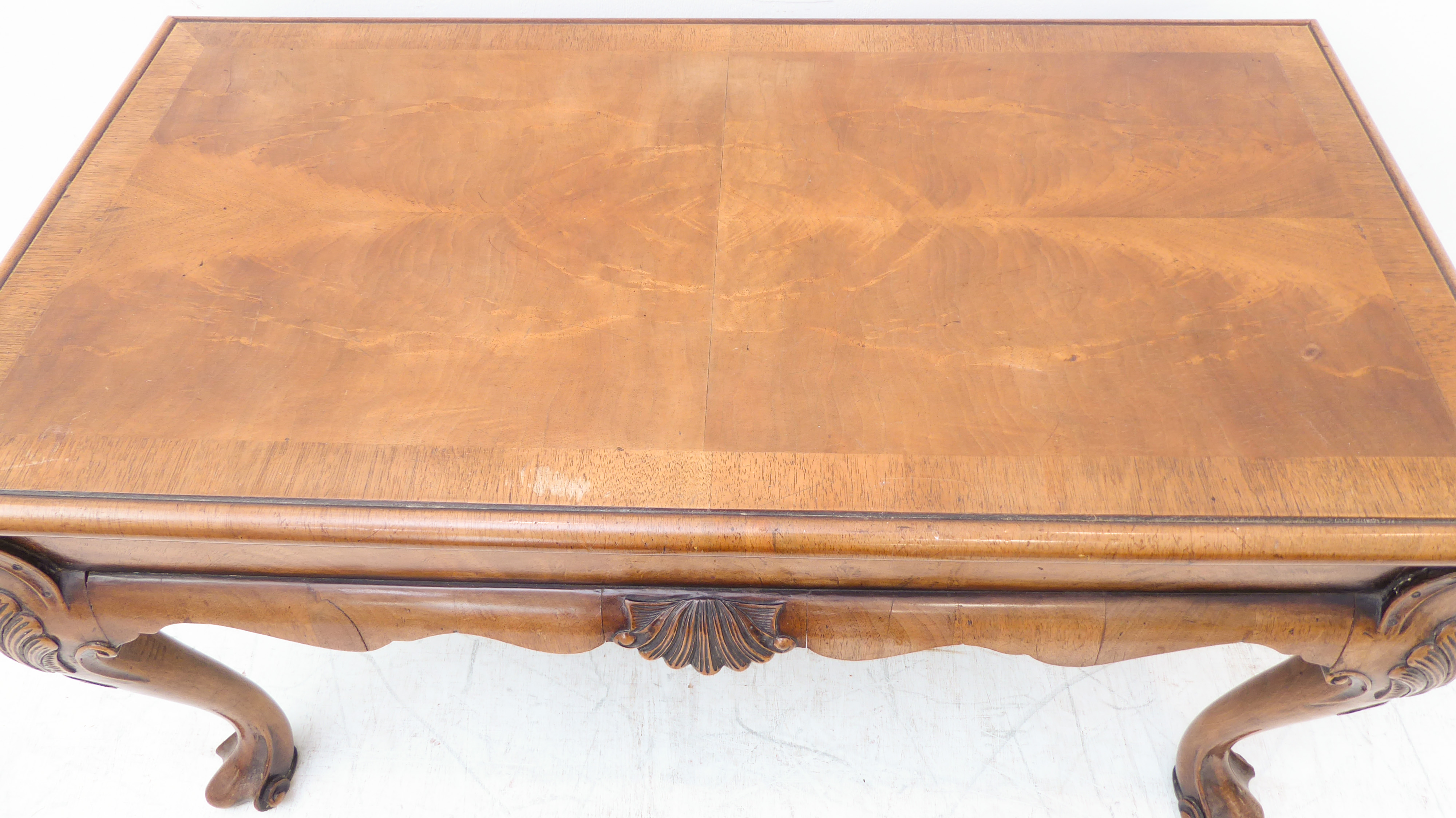 A good walnut coffee table in 18th century style: the quarter veneered crossbanded moulded top above - Image 4 of 4