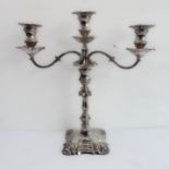 A large and impressive silver three light candelabra with removeable sconces and the centre to