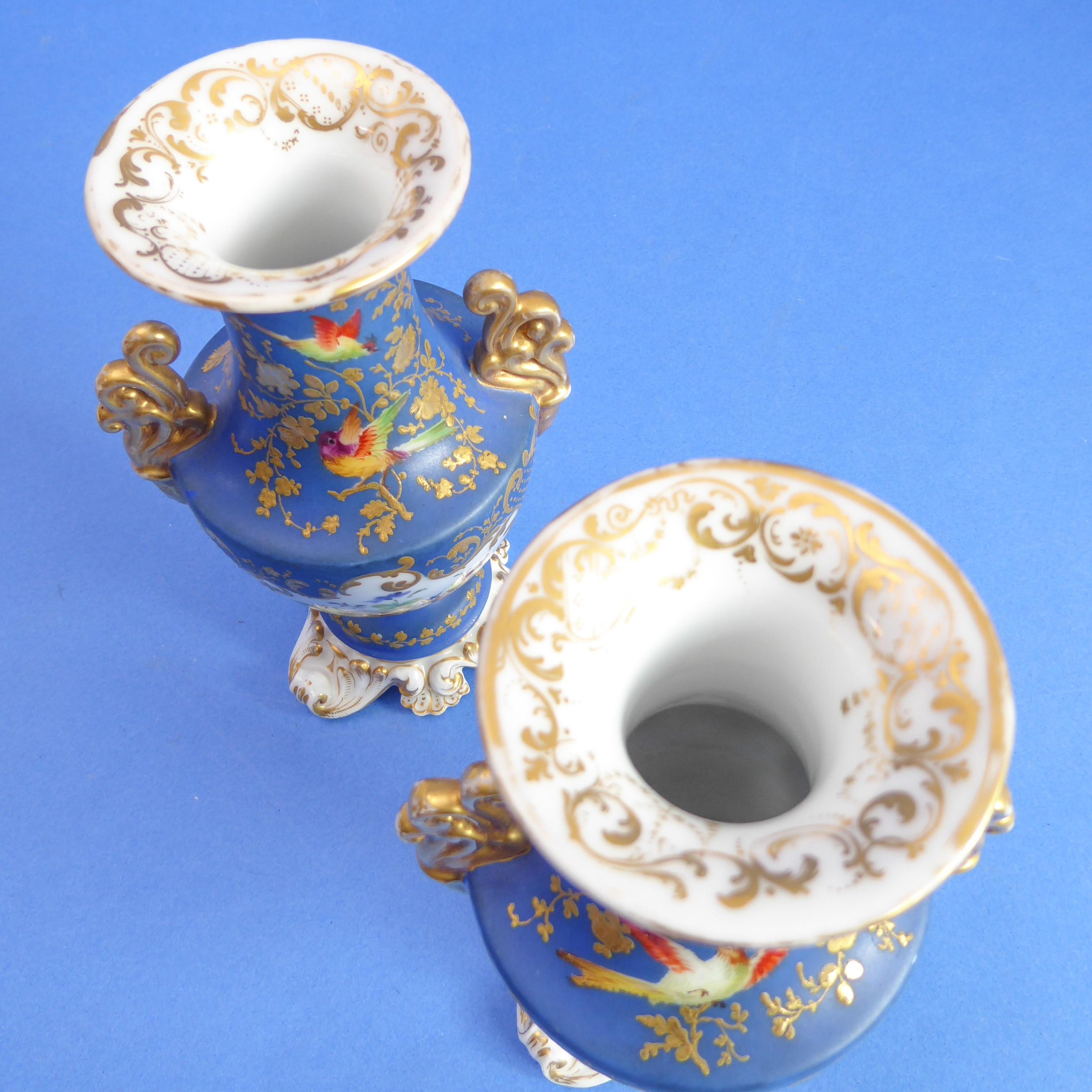 A pair of 19th century French porcelain vases: each with two gilt handles and vignettes of floral - Image 3 of 4