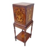 A 19th century walnut and floral marquetry cabinet-on-stand of small proportions: single end door